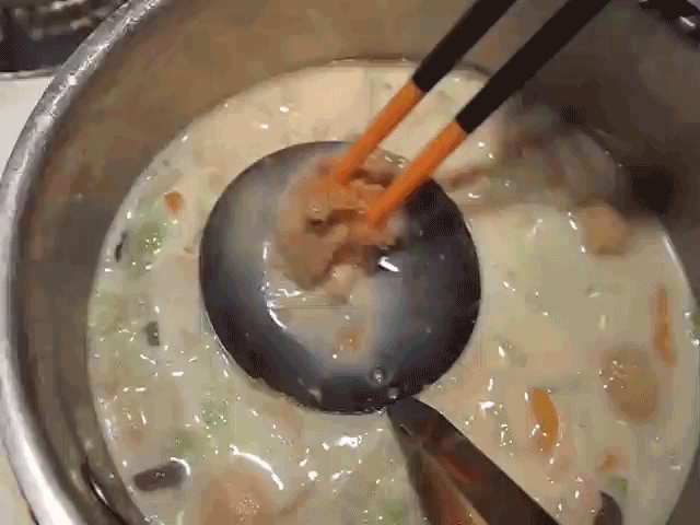 mixing miso paste into the soup 
