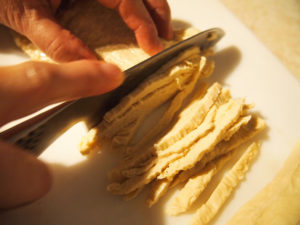 chopping yuba into thin strips